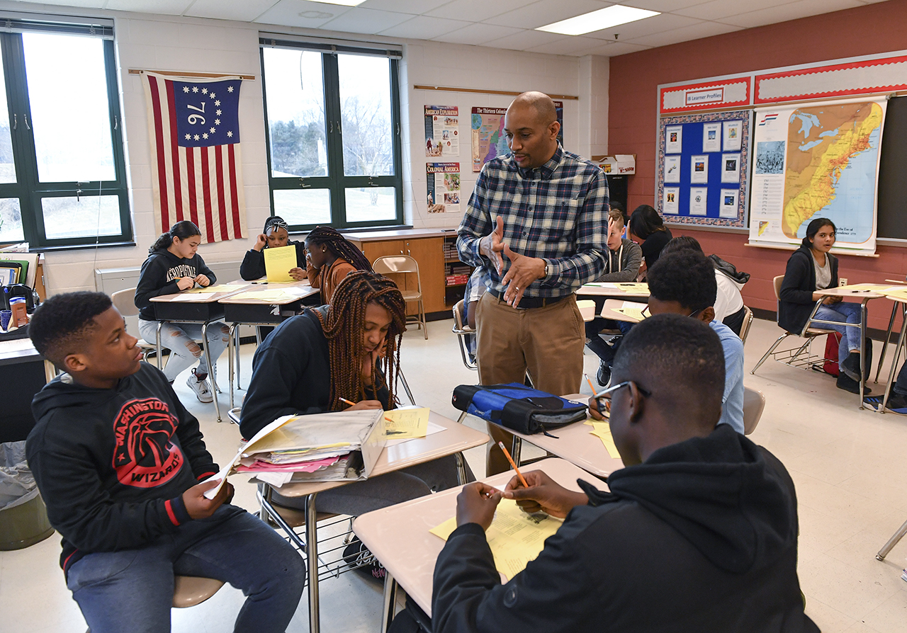 History teacher Philip E. Jackson speaks to a group of his students as he teaches the history of slavery to his eighth graders at Dr.Martin Luther King, Jr., Middle School on February 27, 2019 in Germantown, Md. (Photo by Ricky Carioti/The Washington Post via Getty Images)